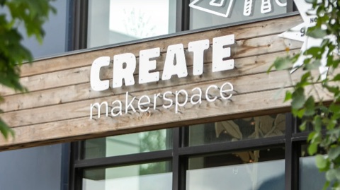 The Create Makerspace sign, white letters on a timber facade